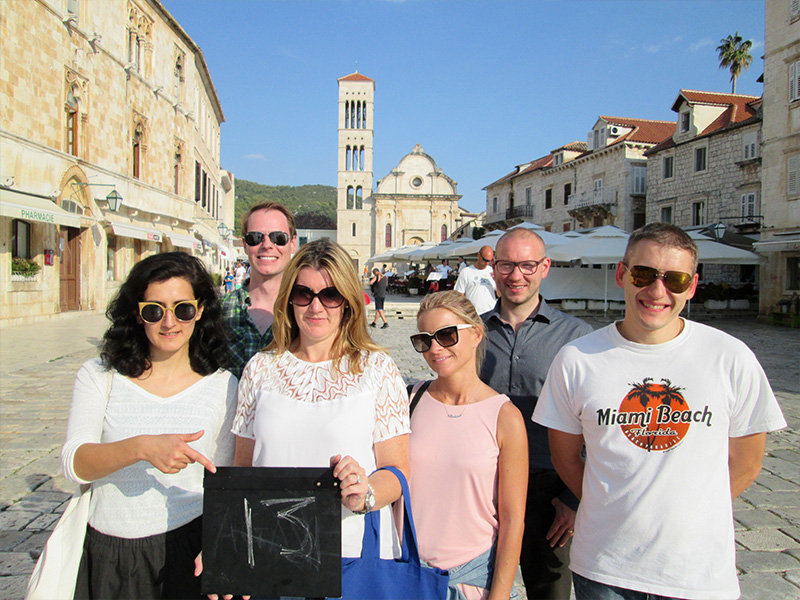 Employees completing sustainability challenges during a CSR scavenger hunt