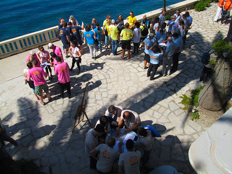 Corporate team navigating a CSR scavenger hunt through a historic Croatian town