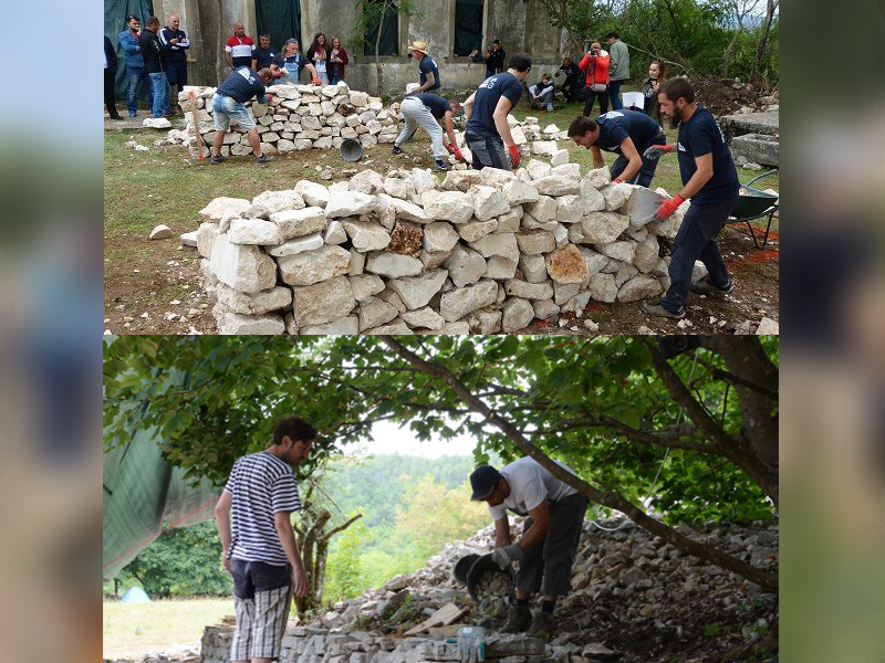 orporate volunteers learning dry stone wall techniques for heritage preservation