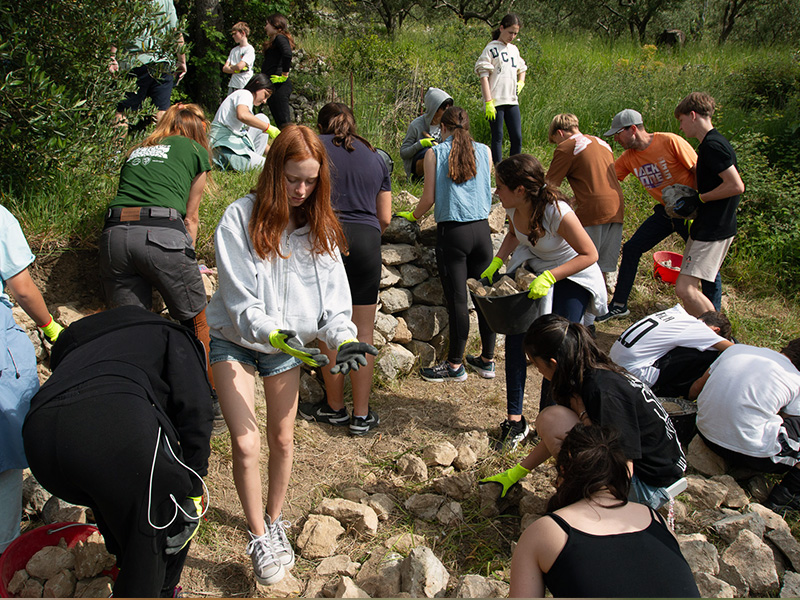CSR group repairing a cultural landscape feature using dry stone methods