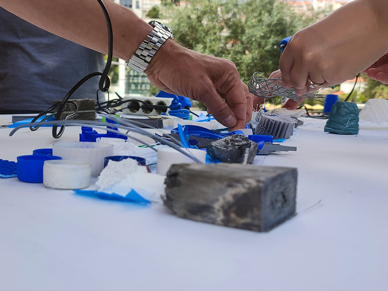 Participants designing upcycled art pieces as part of a CSR activity