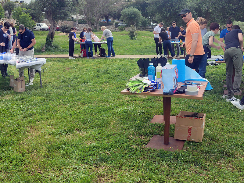 Corporate team turning plastic waste into community art installations